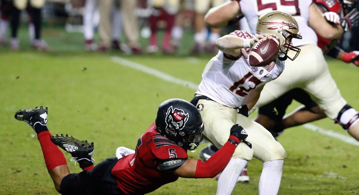 N.C. State linebacker C.J. Hart Jr. (5) sacks Florida State quarterback Chubba Purdy (12) during the second half of N.C. State&#8217;s 38-22 victory over Florida State at Carter-Finley Stadium in Raleigh, N.C., Saturday, Nov. 14, 2020.