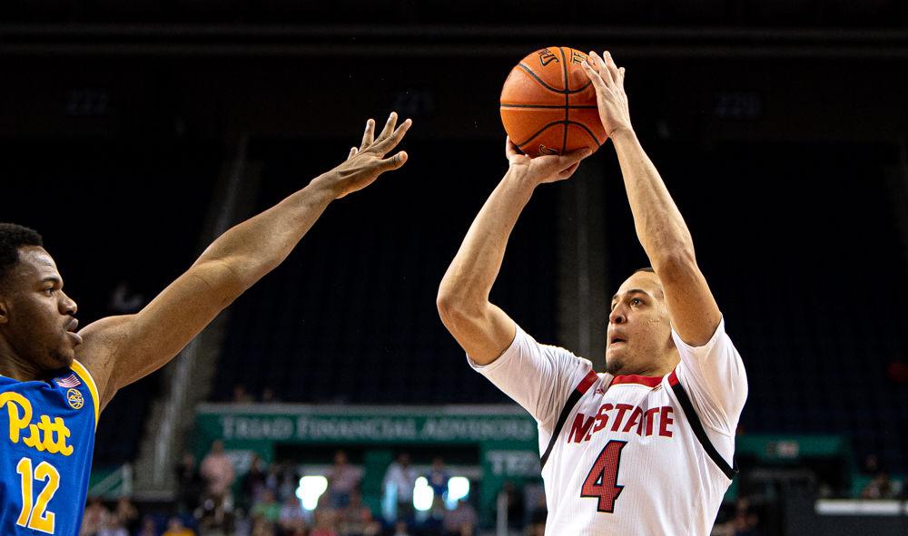 Sophomore forward Jericole Hellems shoots against Pittsburgh on Wednesday, March 11, 2020 at Greensboro Coliseum. The Wolfpack won their season opener 73-58.