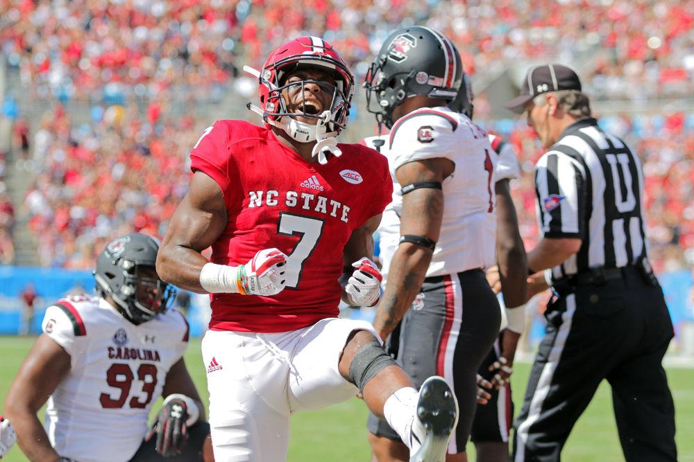 Junior running back Nyheim Hines [BW1]&#160;celebrates after breaking through the line for a short touchdown against South Carolina on Saturday, Sept. 2, 2017 at Bank of America Stadium in Charlotte. Hines had 83 yards on 15 carries and 1 touchdown during the 35-28 loss.