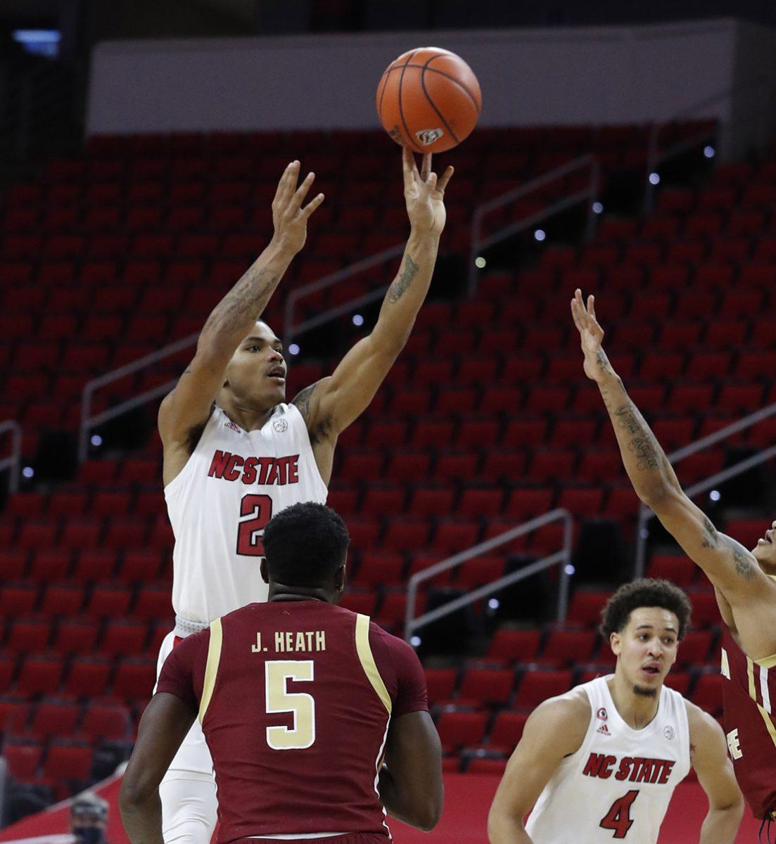 N.C. State's Shakeel Moore (2) makes the jumper with 26 seconds left in the game to give the Wolfpack the lead during the second half of N.C. State&#8217;s 79-76 victory over Boston College at PNC Arena in Raleigh, N.C., Wednesday, December 30, 2020.