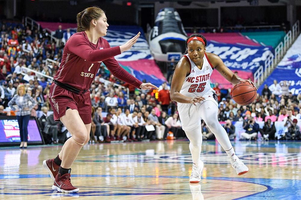Junior forward Kayla Jones drives to the basket during the 2020 ACC Women's Tournament championship game versus the Florida State Seminoles on Sunday, March 8, 2020 in the Greensboro Coliseum. This is the Wolfpack's first ACC tournament championship since 1991. The Wolfpack beat the Seminoles 71-66.