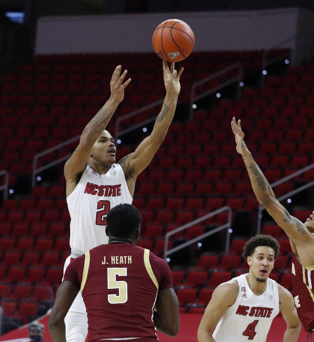 N.C. State's Shakeel Moore (2) makes the jumper with 26 seconds left in the game to give the Wolfpack the lead during the second half of N.C. State&#8217;s 79-76 victory over Boston College at PNC Arena in Raleigh, N.C., Wednesday, December 30, 2020.