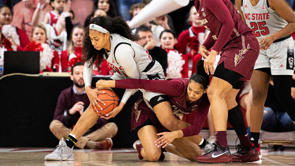 Freshman wing Jakia Brown-Turner fights for a loose ball against Florida State forward London Clarkson on Thursday, Jan. 16, 2020 at Reynolds Coliseum. Brown-Turner recorded 18 points and eight rebounds as the Wolfpack won 68-51.