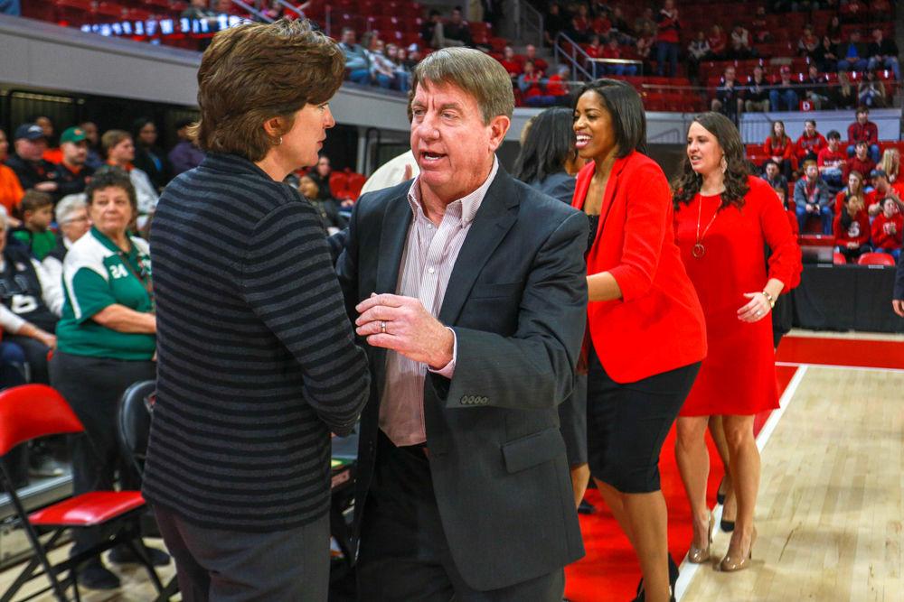 Head coach Wes Moore shakes hands with head coach Katie Meier prior to the 70-68 win over No. 15 Miami in Reynolds Coliseum on Sunday, March 3.