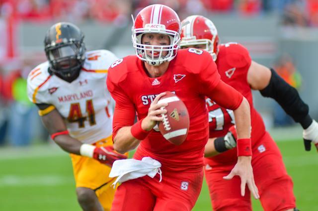 Redshirt junior quarterback Mike Glennon makes a run during the game against Maryland in Carter-Finley Saturday, Nov. 26. Glennon threw five touchdowns and 506 yards in the 56-41 Wolfpack win. Photo by Alex Sanchez.