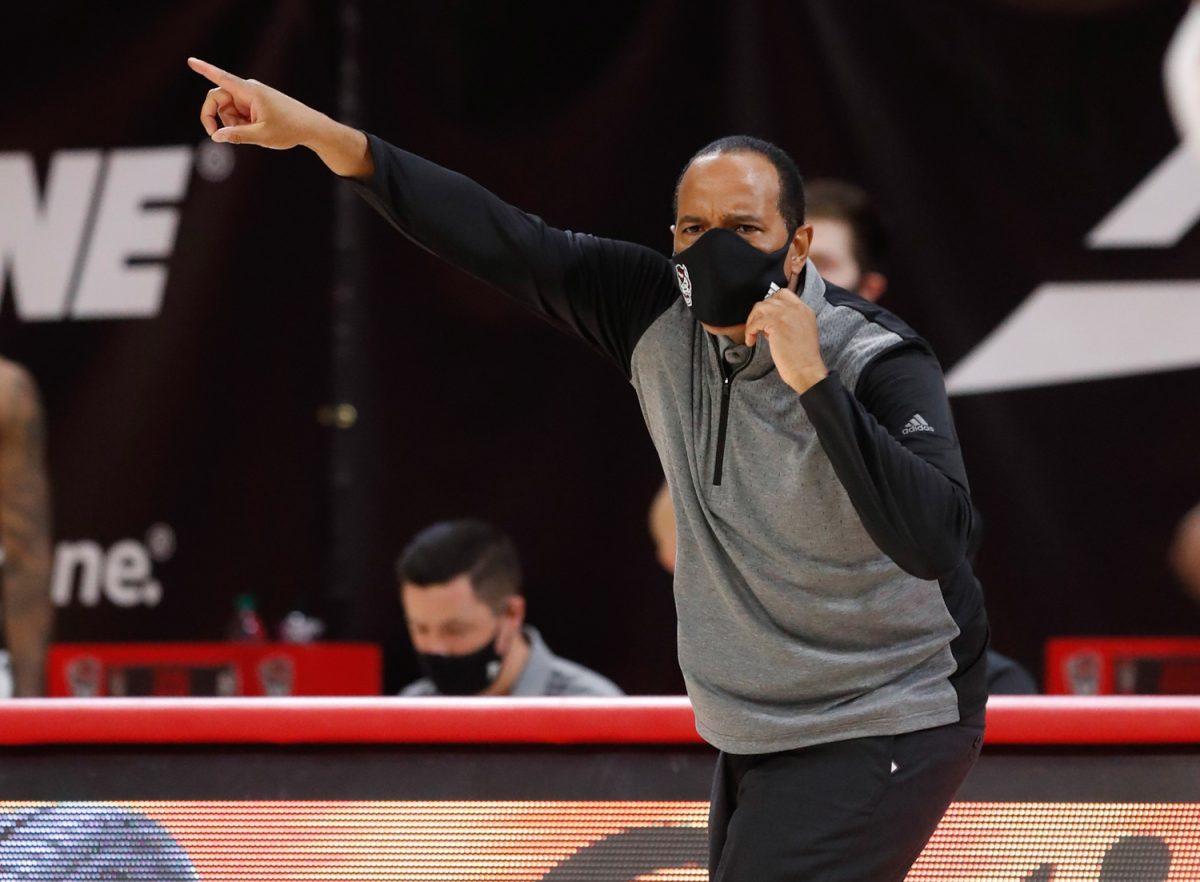 N.C. State's head coach Kevin Keatts yells to his team during the first half of N.C. State&#8217;s game against North Florida in the Mako Medical Wolfpack Invitational at Reynolds Coliseum in Raleigh, N.C., Friday, Nov. 27, 2020.