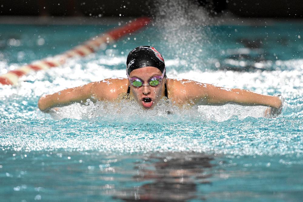 Freshman Kylee Alons competes in the women's 100-yard Butterfly during NC State's meet with rival UNC-Chapel Hill on Jan. 19, 2019 at the Casey Aquatic Center. Alons finished first in the event with a final time of 53.63 and nine points. Both Wolfpack teams were undefeated with a final women's score of 193-101, and men's final score of 197-97.
