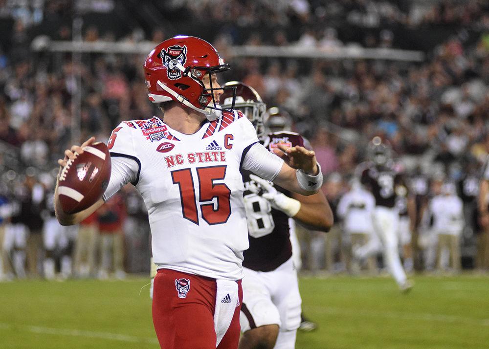 Graduate quarterback Ryan Finley prepared to throw the ball during the Gator Bowl against Texas A&amp;M on Monday, Dec. 31, in the TIAA Bank Field in Jacksonville, Florida. The Wolfpack lost to the Aggies 52-13, ending their season with a 9-4 record.