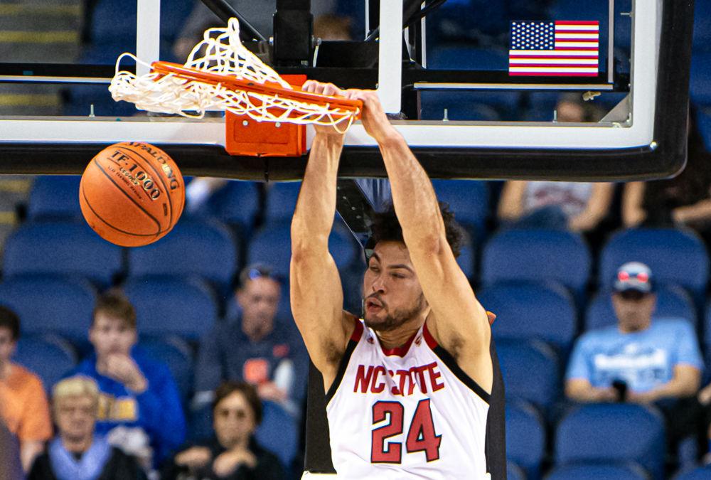 Redshirt junior guard Devon Daniels dunks against Pittsburgh on Wednesday, March 11, 2020 at Greensboro Coliseum. Daniels scored a game-high 23 points and grabbed six rebounds as the Wolfpack won their ACC Tournament opener 73-58.