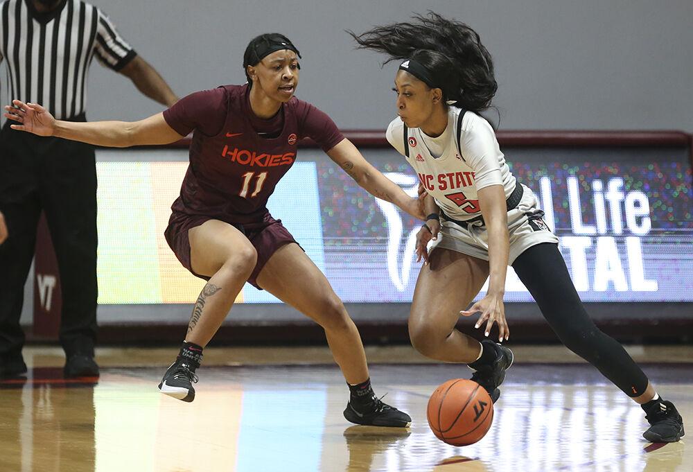 North Carolina State's Jada Boyd (5) drives on Virginia Tech's D&#213;asia Gregg (11) during the first half of an NCAA college basketball game in Blacksburg Va. Thursday January 28 2021. (AP Photo / MATT GENRTY, The Roanoke Times, Pool)