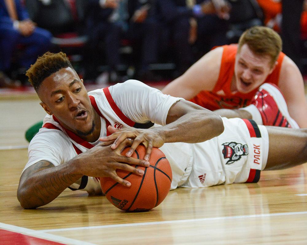 Redshirt freshman forward Manny Bates gets hold of a loose ball during the game versus the Miami Hurricanes on Wednesday, Jan. 15, 2020 in PNC Arena. Bates blocked 3 shots against Miami. The Wolfpack beat the Hurricanes 80-63.