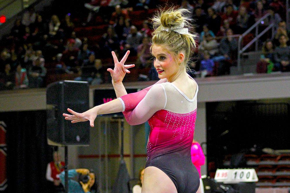 Nicole Webb, a sophomore from Morrisville, North Carolina, looks toward the judges during the gymnastics meet against Pittsburgh on Saturday, Feb. 9. The Wolfpack beat Pittsburgh 196.400-194.825.