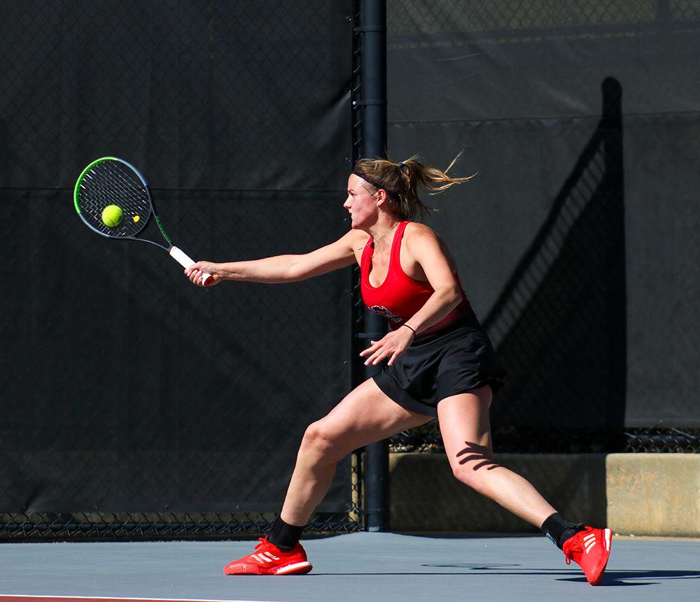 Anna Rogers, a senior studying business administration and accounting, retunrs the volley in her singles match on March, 1 2020 against Virginia at J.W. Isenhour Tennis Center. Rogers achieved a 101-24 record in doubles.