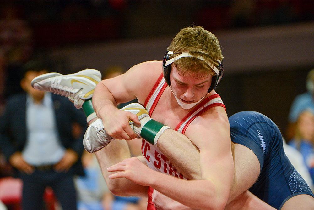 Daniel Bullard, a Redshirt junior wrestling at 174 pounds, keeps control of his opponent's legs in the match against the UNC Tar Heels on Saturday, Feb. 7, 2020. In the 18-19 season, Bullard went 21-11 and 11-8 in duals.
