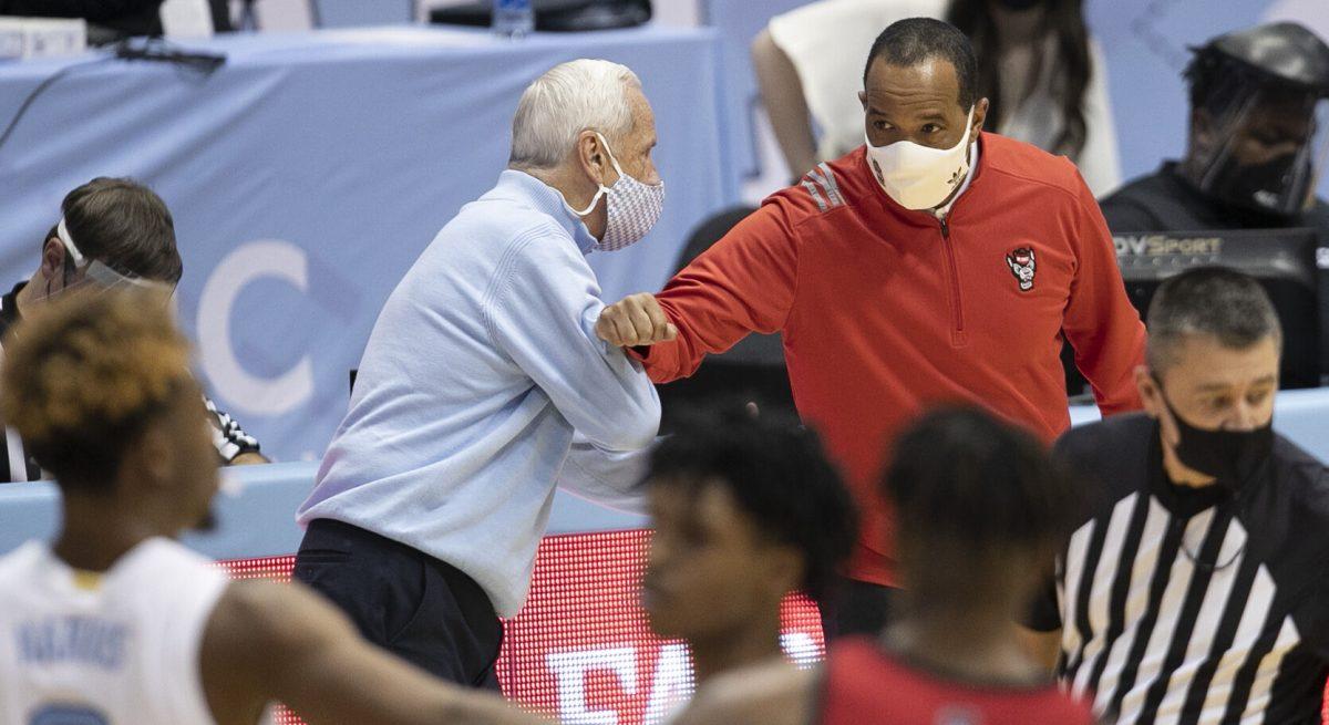 North Carolina coach Roy Williams greets N.C. State coach Kevin Keatts following the Tar Heels' 86-76 victory on Saturday, January 23, 2021 at the Smith Center in Chapel Hill, NC.
