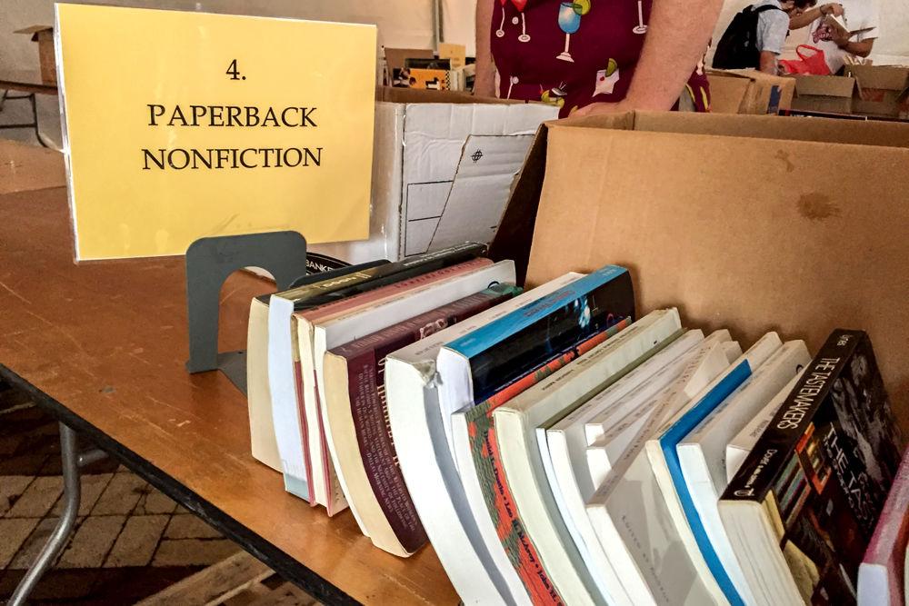 Paperback nonfiction books stand on display at the Frank B. Armstrong Memorial Book Sale, which took place on The Brickyard from Monday, April 8 through Friday, April 12. Sales went toward funding NCSU Libraries.