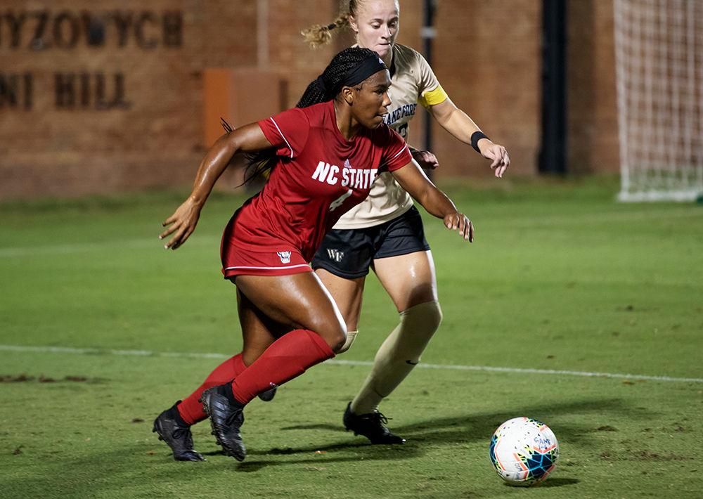 Freshman forward Leyah Hall-Robinson trying to shed a defender in the match against Wake Forest on Sunday, Sept. 29, 2019 at W. Dennie Spry Soccer Stadium. The NC State Wolfpack tied the Wake Forest Demon Deacons 1-1.