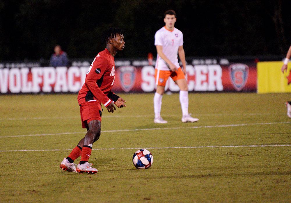 Junior midfielder George Asomani looks for an open pass. NC State lost 0-3 against Clemson on Friday, Nov. 1, 2019 at Dail Soccer Field. The team has a record this season of 8-5-3.