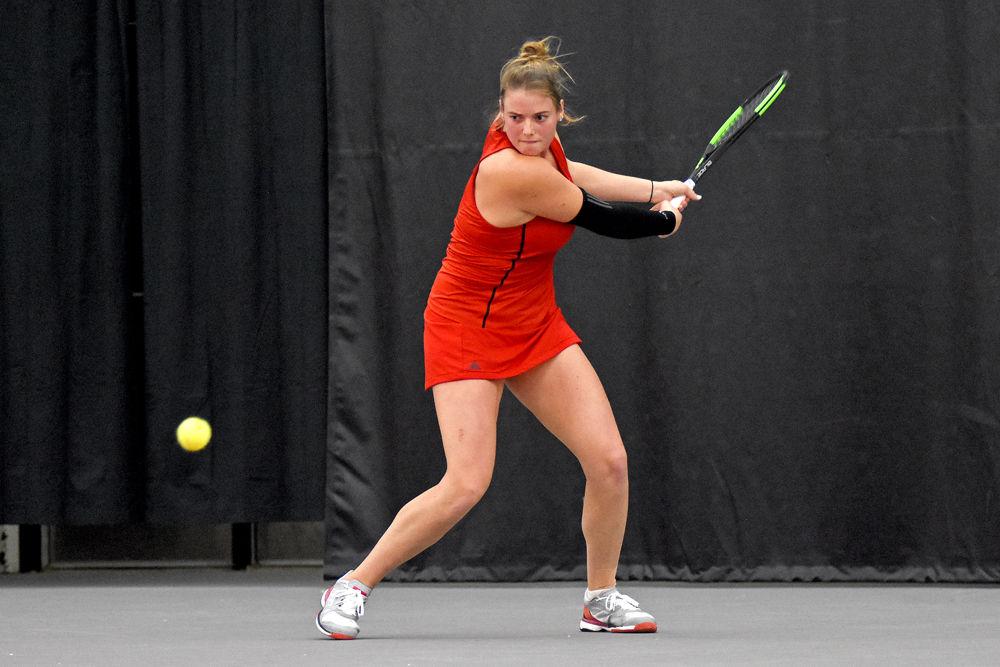 Junior Anna Rogers pulls back to return the ball during her singles match against UNC-Chapel Hill junior Makenna Jones. Rogers lost to Jones 7-6, 6-3, 4-2 on Feb. 27 at J.W. Isenhour Tennis Center.