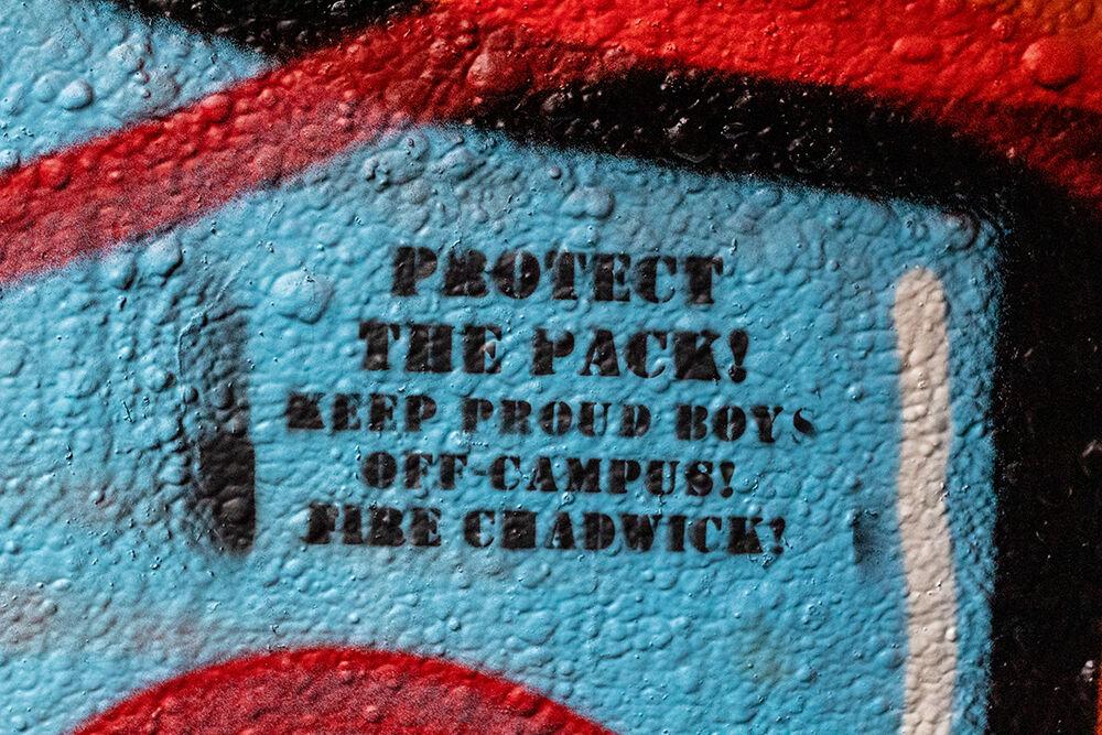 Spray paint that reads "Protect The Pack! Keep Proud Boys Off Campus! Fire Chadwick!" sits on the walls of the Free Expression Tunnel on Tuesday, Jan. 19, 2021.