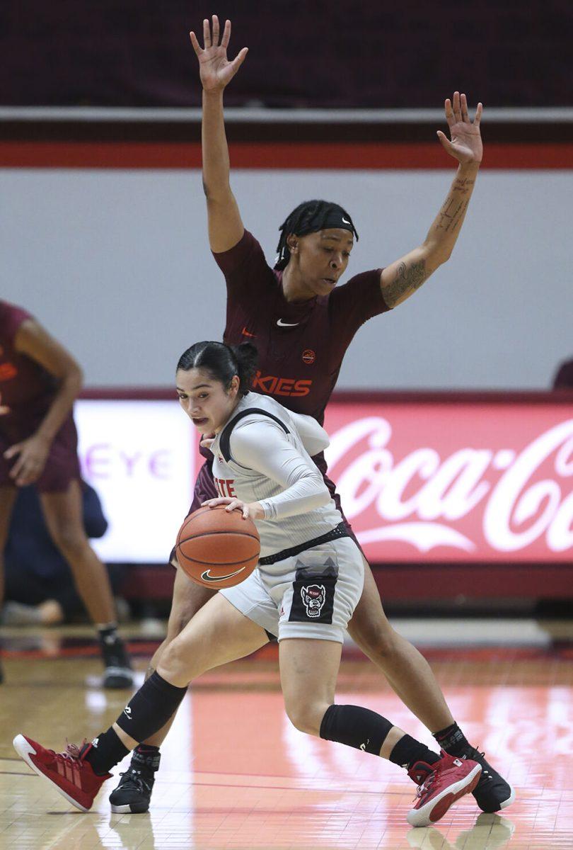 North Carolina State's Raina Perez (2) is guarded by Virginia Tech's D&#213;asia Gregg (11) during the first half of an NCAA college basketball game in Blacksburg Va. Thursday January 28 2021. (AP Photo / MATT GENRTY, The Roanoke Times, Pool)