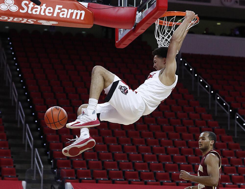 N.C. State's Jericole Hellems (4) slams in two during the first half of N.C. State&#8217;s game against Boston College at PNC Arena in Raleigh, N.C., Wednesday, December 30, 2020.