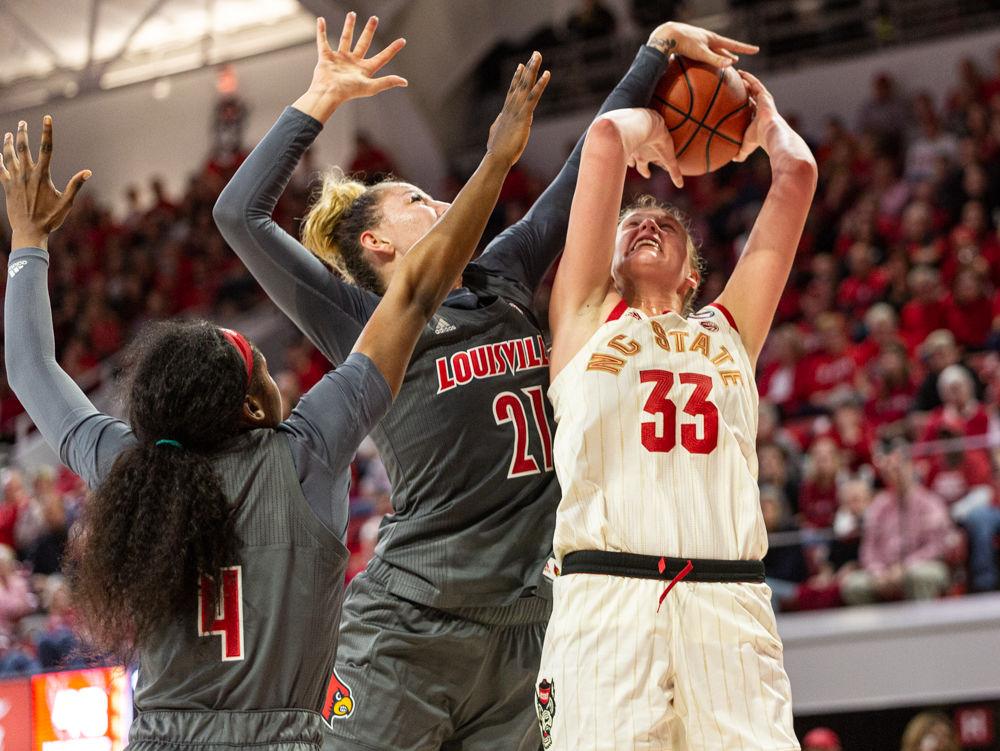 Sophmore center Elissa Cunane is blocked by Louisville forward Elizabeth Balogun on Thursday, Feb. 13, 2020 at Reynolds Coliseum. Cunane went one for 12 from the field and tallied 10 points in the 66-59 loss.