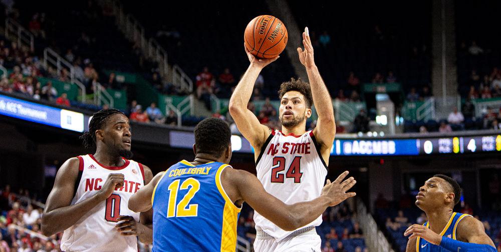 Redshirt junior guard Devon Daniels shoots against Pittsburgh on Wednesday, March 11, 2020 at Greensboro Coliseum. Daniels scored a game-high 23 points and grabbed six rebounds as the Wolfpack won their ACC Tournament opener 73-58.
