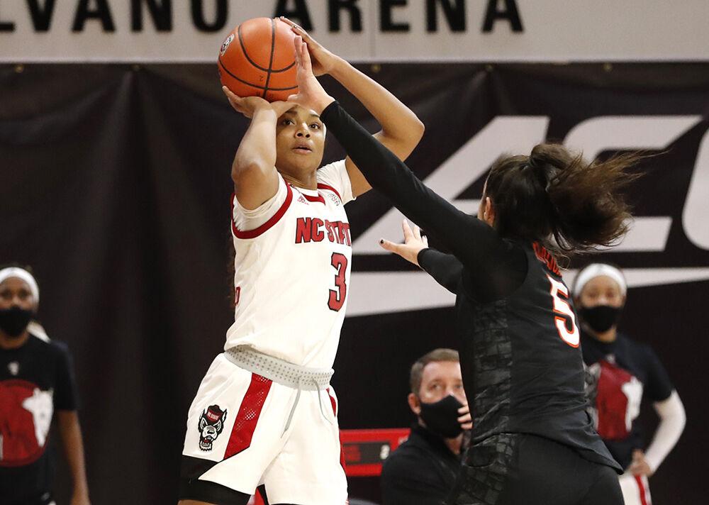 N.C. State's Kai Crutchfield (3) shoots as Virginia Tech's Georgia Amoore (5) defends during the second half of N.C. State&#8217;s 89-87 victory over Virginia Tech at Reynolds Coliseum in Raleigh, N.C., Sunday, January 24, 2021.