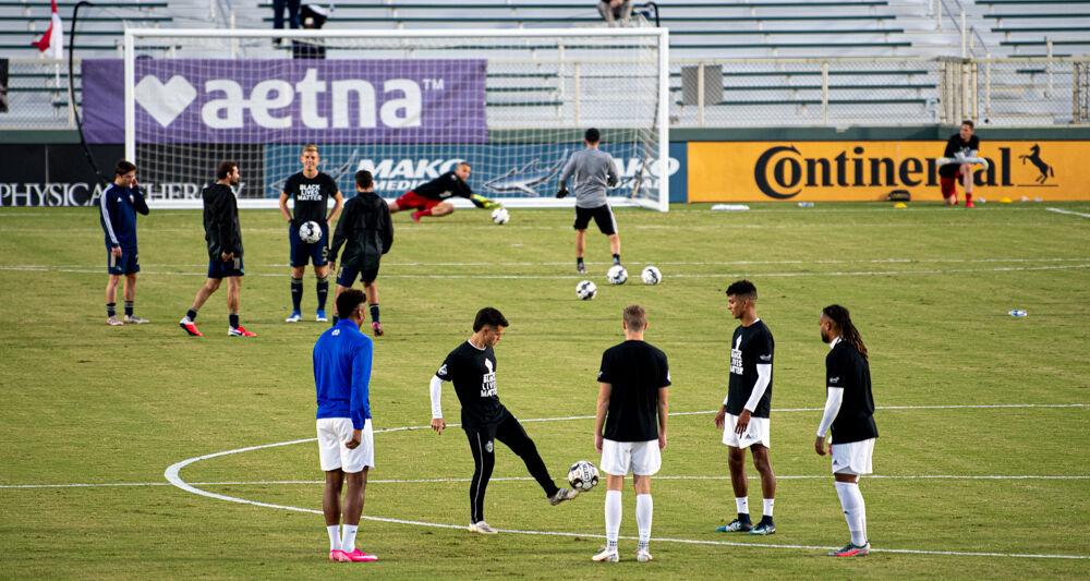 Charlotte Independence players warm up around midfield while North Carolina FC players warm up near their own goal before the game on Saturday, Oct. 3, 2020 at WakeMed Soccer Park. NCFC lost 1-0.