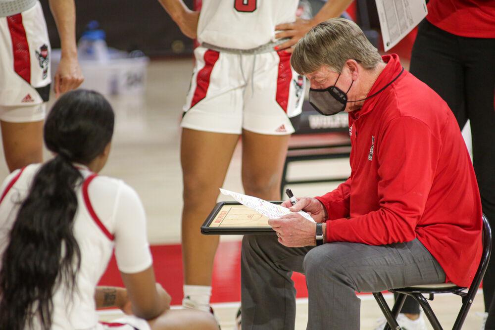 Head coach Wes Moore talks to his team during a timeout as No. 4 NC State women&#8217;s basketball took down Clemson 86-65 on Thursday, Feb. 11, 2021 in Reynolds Coliseum.