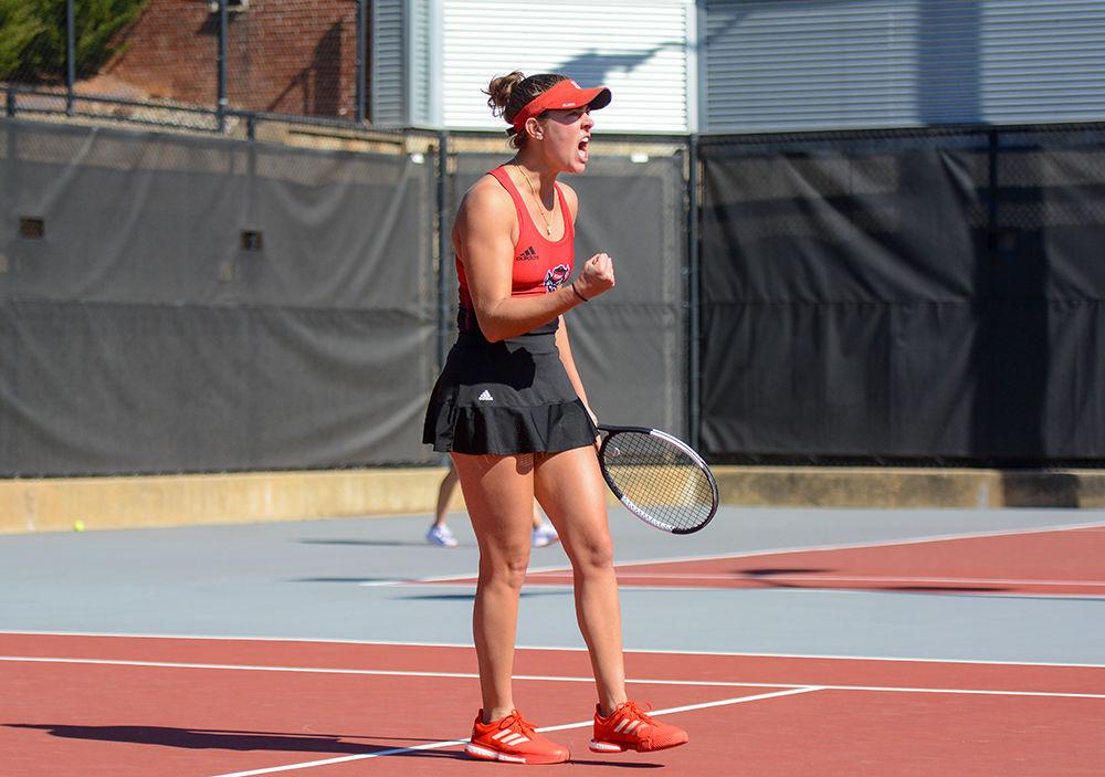 Senior Adriana Reami celebrates her victory against Virginia on Sunday, March 1, 2020 at J.W. Isenhour Tennis Center. Reami and junior Jaeda Daniel lost their doubles match to Virginia 6-3.