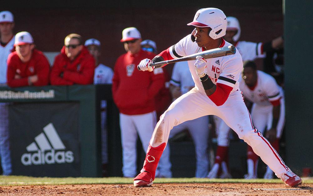 Terrel Tatum, a third year outfielder, shows the bunt at the baseball game against James Madison on Saturday, Feb. 15 at Doak Field. The series was the first games of the season for the Wolfpack.