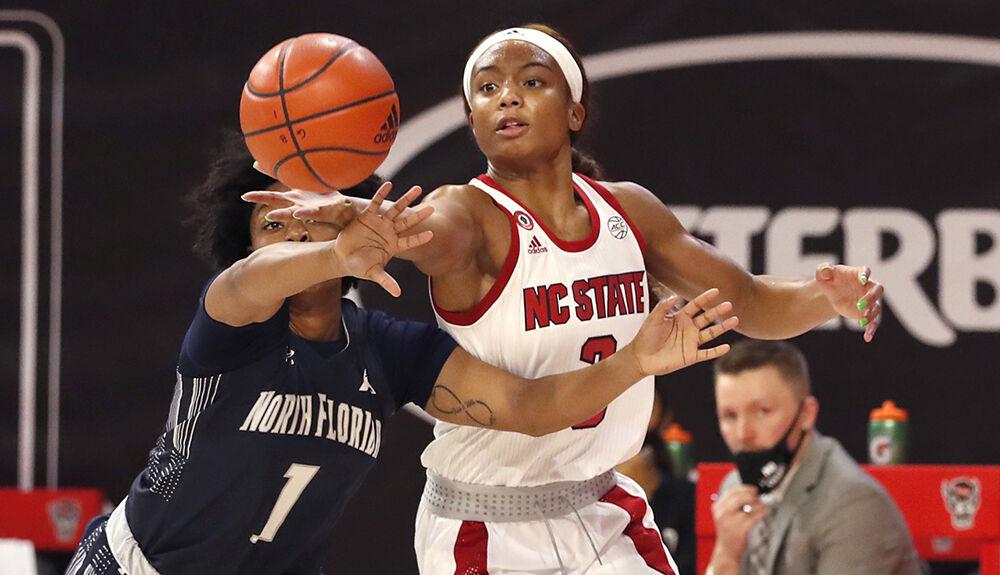 N.C. State's Kai Crutchfield (3) takes the rebound from North Florida's Nubia Imani Benedith (1) during the first half of N.C. State&#8217;s game against North Florida at Reynolds Coliseum in Raleigh, N.C., Wednesday, Nov. 25, 2020.
