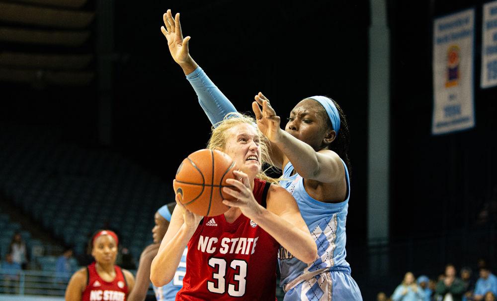 Sophomore center Elissa Cunane attacks the basket against UNC-Chapel Hill center Janelle Bailey on Thursday, Jan. 9 at Carmichael Arena. Cunane recorded eight points and 13 rebounds as the Wolfpack suffered their first loss of the season 66-60.