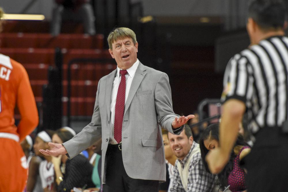 Head coach Wes Moore questions the official on a no foul call in the Wolfpack's 65-53 win over Clemson on Jan 22.