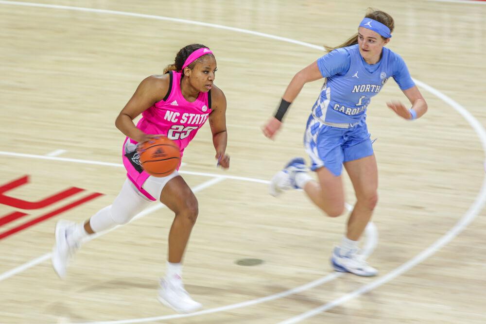 Senior forward Kayla Jones brings the ball up the court. Jones presence could be felt all over the court as she filled the box sheet, putting up a stat in every category. Jones had 20 points, eight rebounds and two assists while also adding a steal and a block in the contest. The Wolfpack took down UNC 82-63 in the Play4Kay game on Sunday, Feb 21 in Reynolds Coliseum.