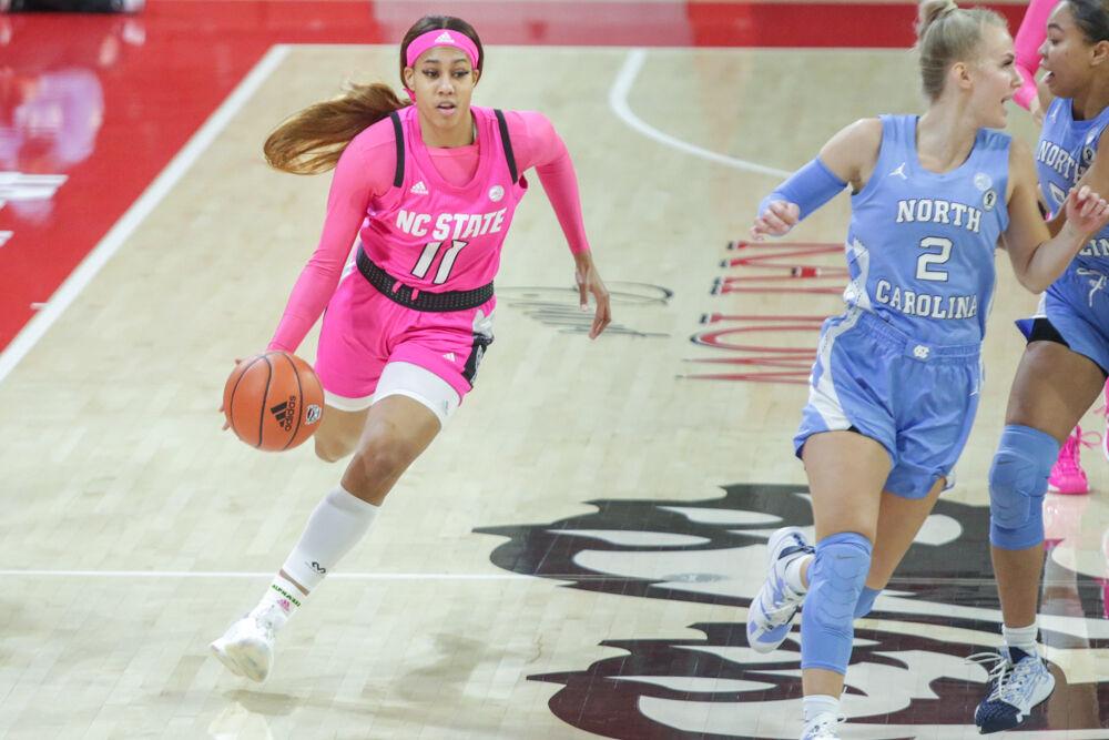 Sophomore wing Jakia Brown-Turner brings the ball up the court. Brown-Turner was an offensive powerhouse leading all players with 25 points including a blistering 4-for-5 from deep. The Wolfpack took down UNC 82-63 in the Play4Kay game on Sunday, Feb 21 in Reynolds Coliseum.