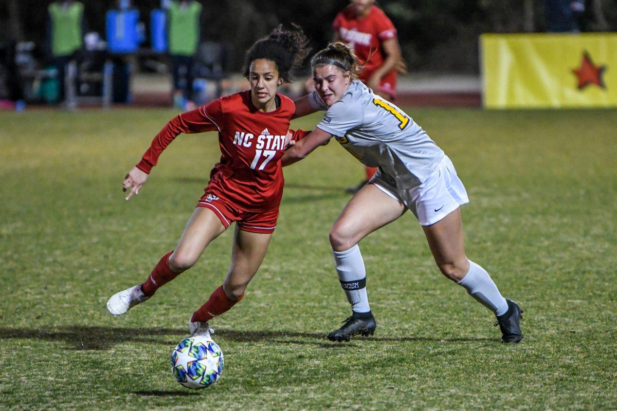 Senior midfielder Mikhail Johnson fights to get to the ball during the game versus UNCG on Wednesday, Feb. 24, 2021 in Dail Soccer Stadium. The Wolfpack tied the Spartans 0-0 following two overtime periods.