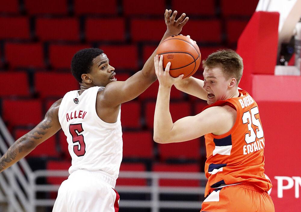 Syracuse's Buddy Boeheim (35) pulls in the ball from N.C. State's Thomas Allen (5) during the second half of Syracuse&#8217;s 77-68 victory over N.C. State at PNC Arena in Raleigh, N.C., Tuesday, February 9, 2021.