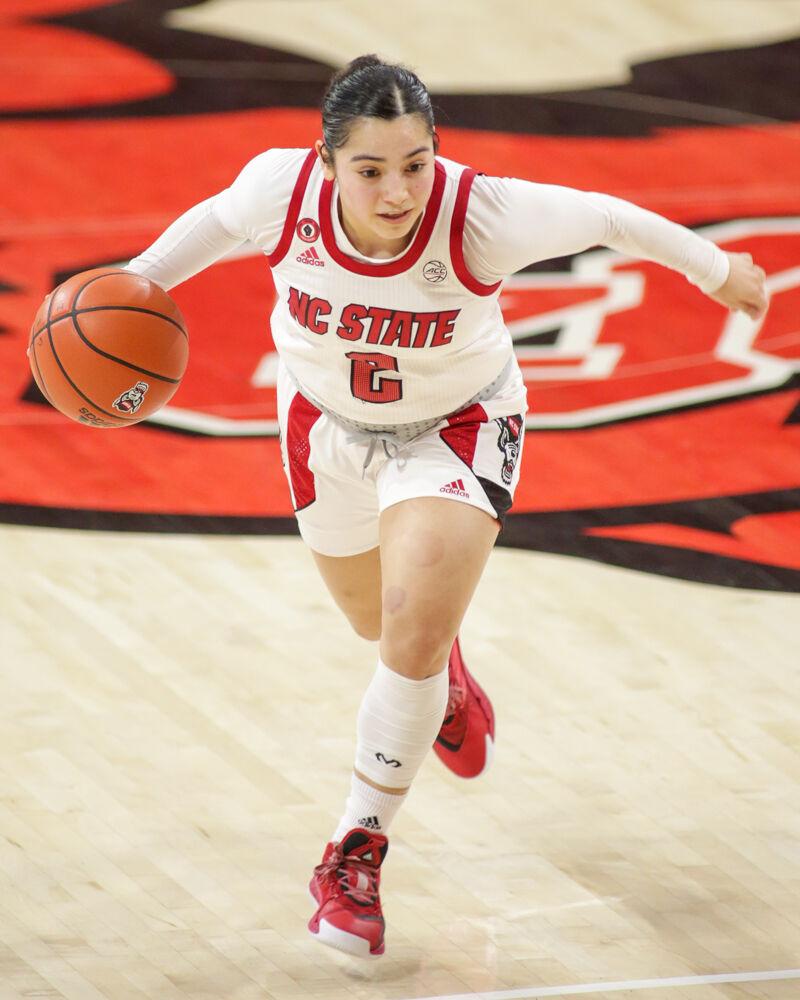 Graduate guard Raina Perez brings the ball up the court. Perez ran the offense and tied for a team-high seven assists as No. 4 NC State women&#8217;s basketball took down Clemson 86-65 on Thursday, Feb. 11, 2021 in Reynolds Coliseum.