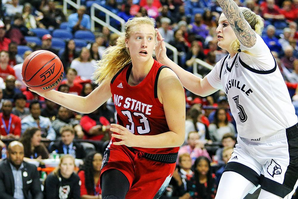 Freshman center Elissa Cunane drives in past Louisville's Sam Fuehring during the 78-68 loss to Louisville on Saturday, March 9 in Greensboro Coliseum.