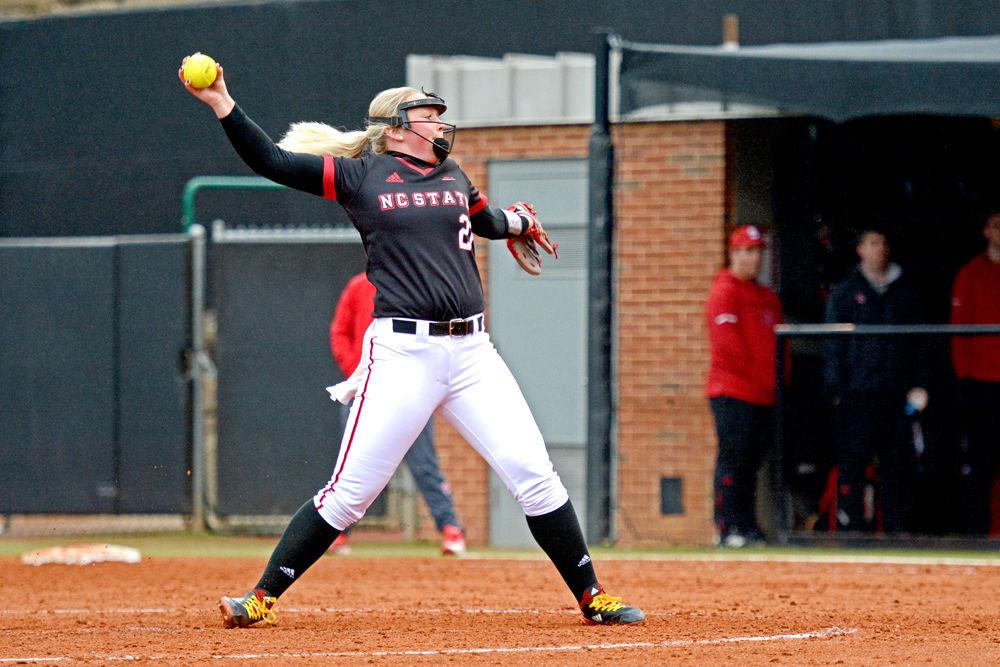 Freshman pitcher Sydney Nester winds up to pitch against Wisconsin on Sunday, Feb. 17, 2019 at Dail Softball Stadium. Nester pitched three innings, striking out two and giving up four hits, five walks and one earned run. The Wolfpack lost 6-3.