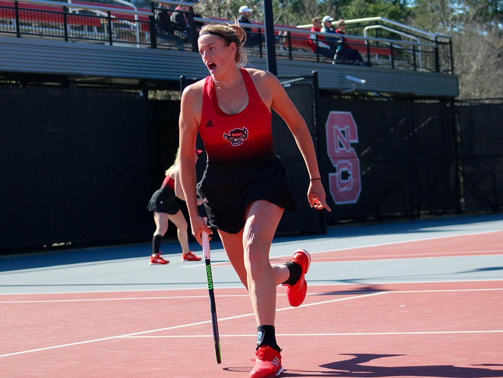 Anna Rogers, a senior studying business administration and accounting, celebrates while calling the ball out in her singles match on March, 1 2020 against Virginia at J.W. Isenhour Tennis Center. Rogers achieved a 101-24 record in doubles.
