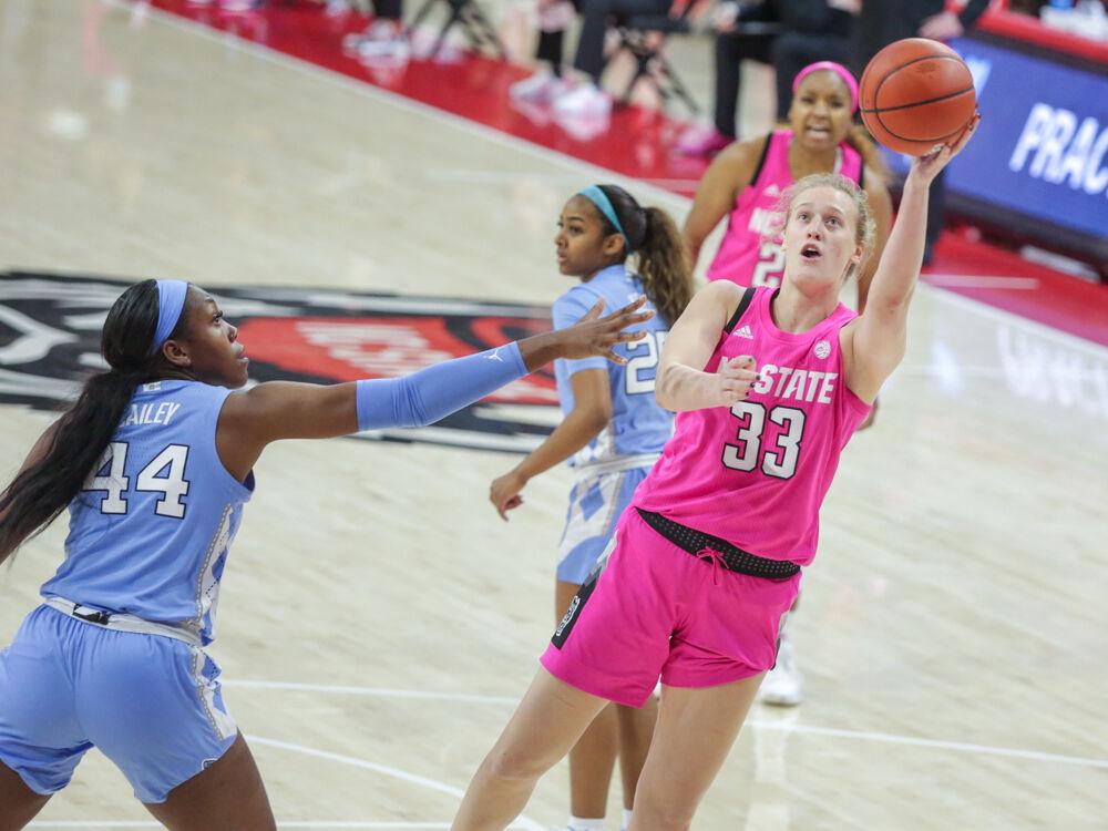 Junior center Elissa Cunane shoots the ball mid-dive. Cunane posted yet another double-double with 17 points and a team-high 14 rebounds. The Wolfpack took down UNC 82-63 in the Play4Kay game on Sunday, Feb 21 in Reynolds Coliseum.