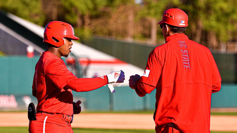 Junior infielder and outfielder Devonte Brown reaches first base after drawing a walk against James Madison on Friday, Feb. 14, 2020 at Doak Field. Brown went 2-3 with two doubles, one run batted in and one run scored as the Wolfpack won the season-opener 4-0.
