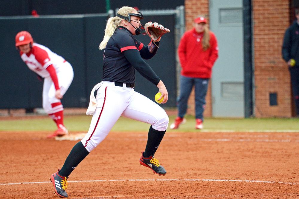 Freshman pitcher Sydney Nester winds up to pitch against Wisconsin on Sunday, Feb. 17, 2019 at Dail Softball Stadium. Nester pitched three innings, striking out two and giving up four hits, five walks and one earned run. The Wolfpack lost 6-3.