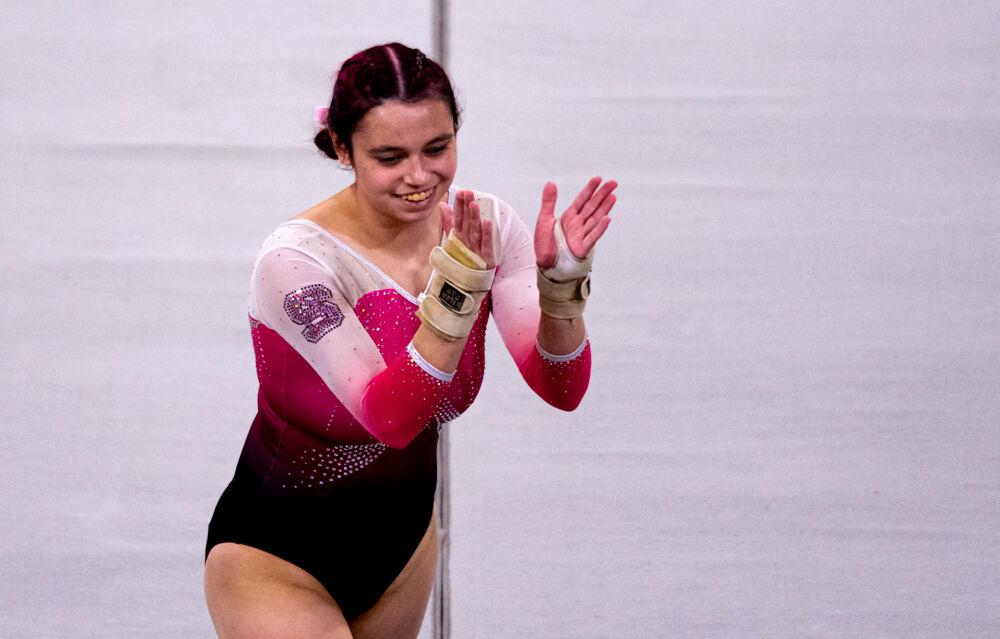 Sophomore Chloe Negrete finishes her floor routine on Saturday, Feb. 6, 2021 at Reynolds Coliseum. Negrete scored a team-high 9.925 in the event. The Wolfpack took first place over North Carolina, Pitt and Towson with a team score of 196.025.