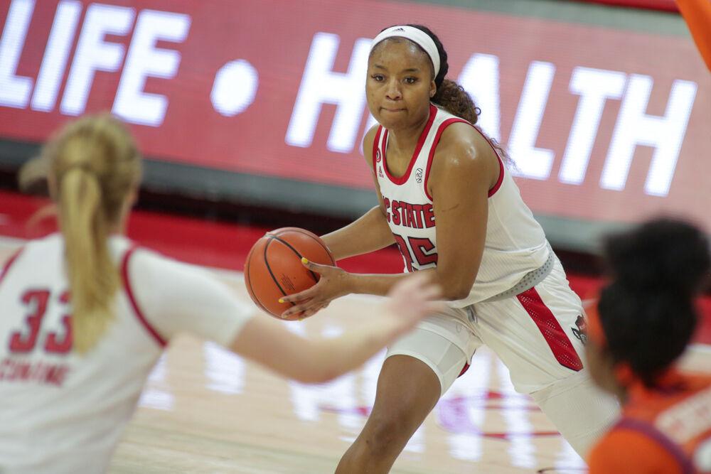 Senior forward Kayla Jones passes too Junior center Elissa Cunane on the interior. No. 4 NC State women&#8217;s basketball took on Clemson on Thursday, Feb. 11, 2021 in Reynolds Coliseum.