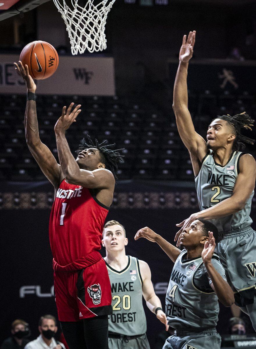 NC State guard Dereon Seabron (1) shoots on Saturday, Feb. 20, 2021 in Winston-Salem, N.C. (Winston-Salem Journal/Andrew Dye) 022121-wsj-spt-wakebasketball